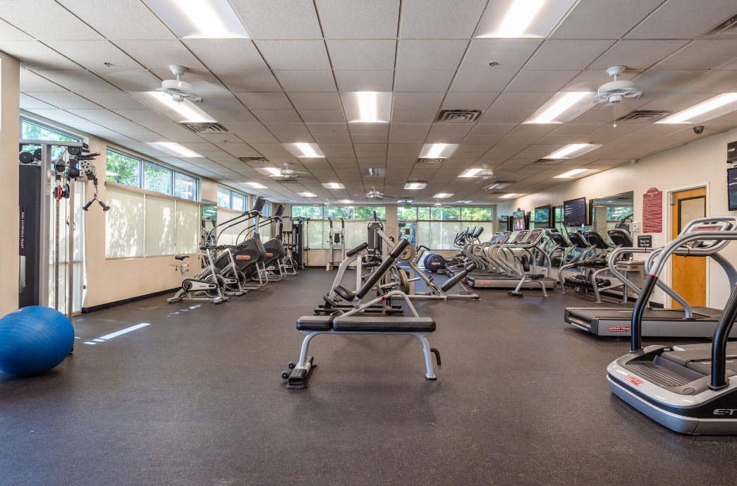 Fully equipped fitness center at The Alpine