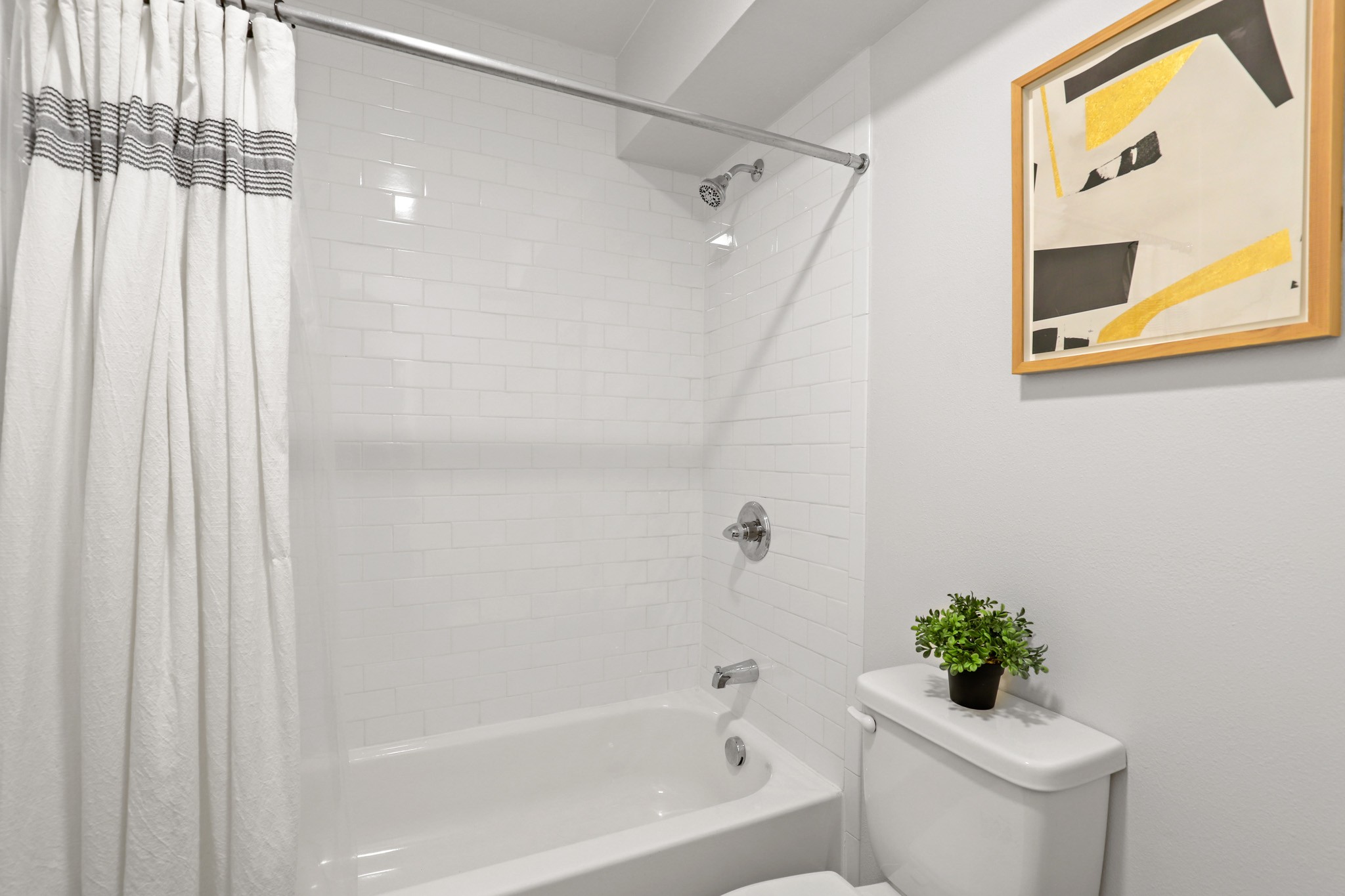 Bathroom with tiled tub shower combination at The Alpine