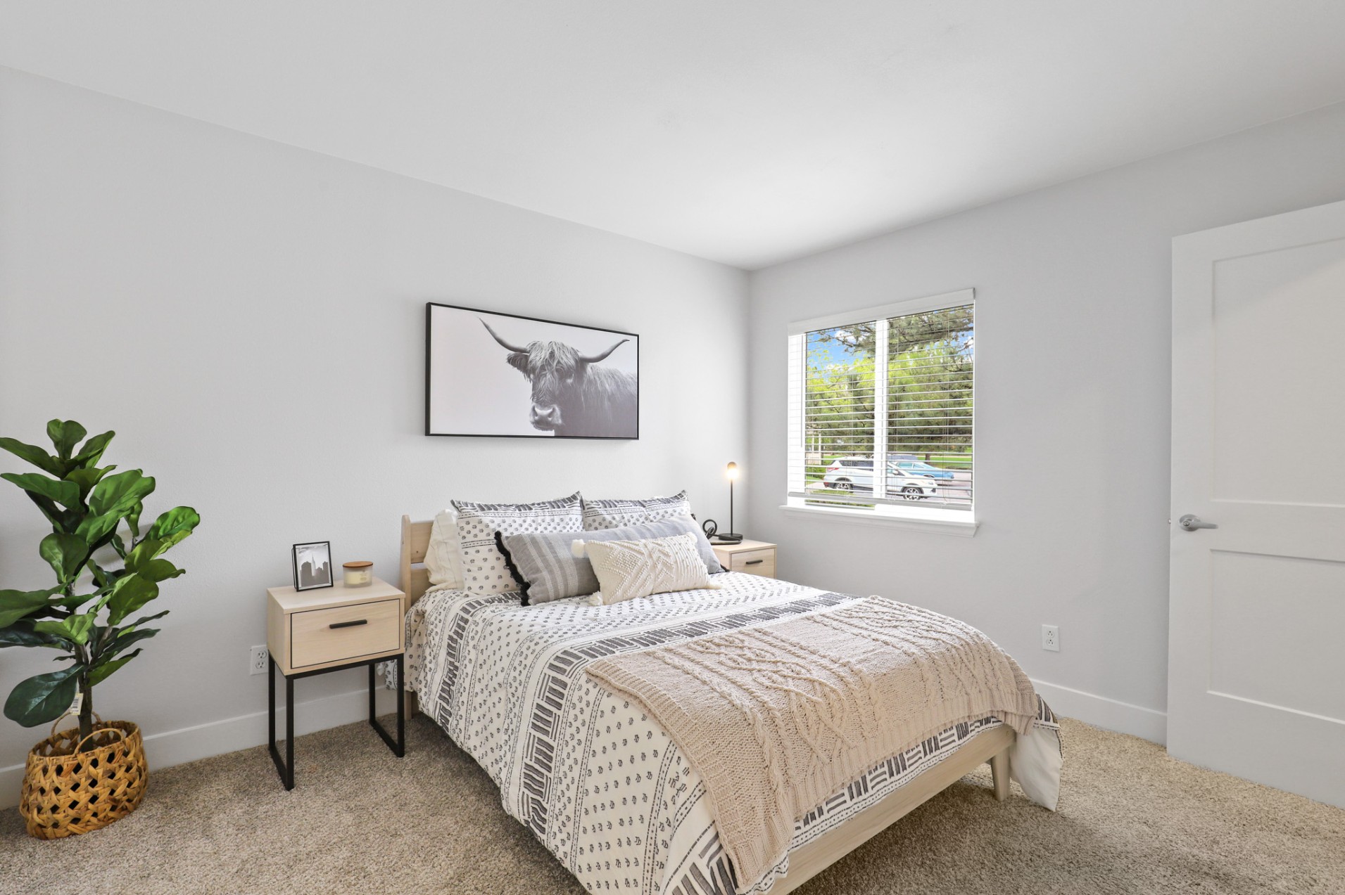 Carpeted model bedroom at The Alpine