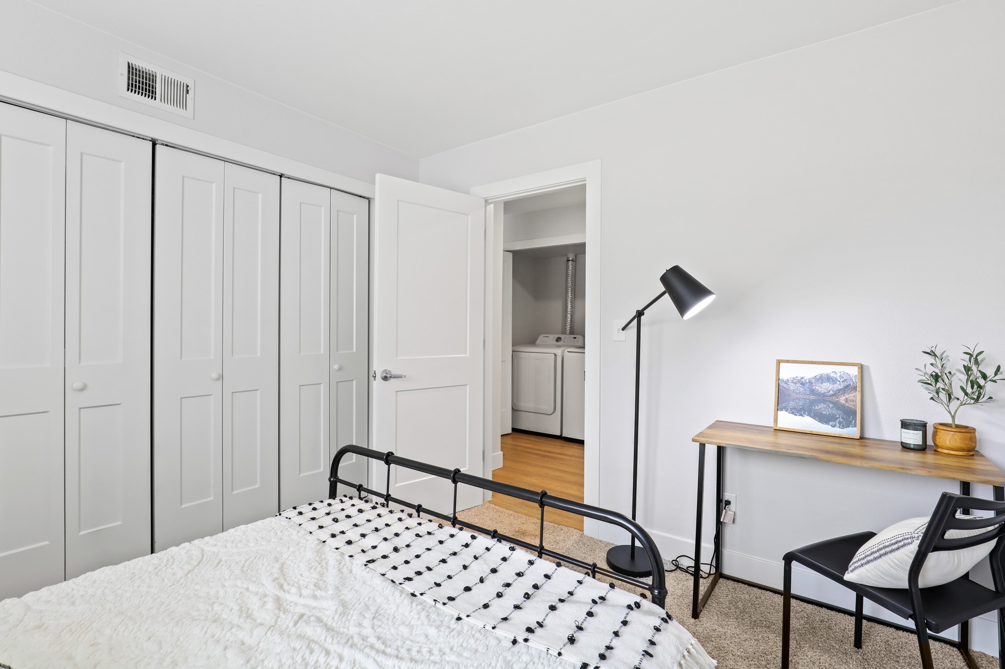 Bedroom with a desk and spacious closets