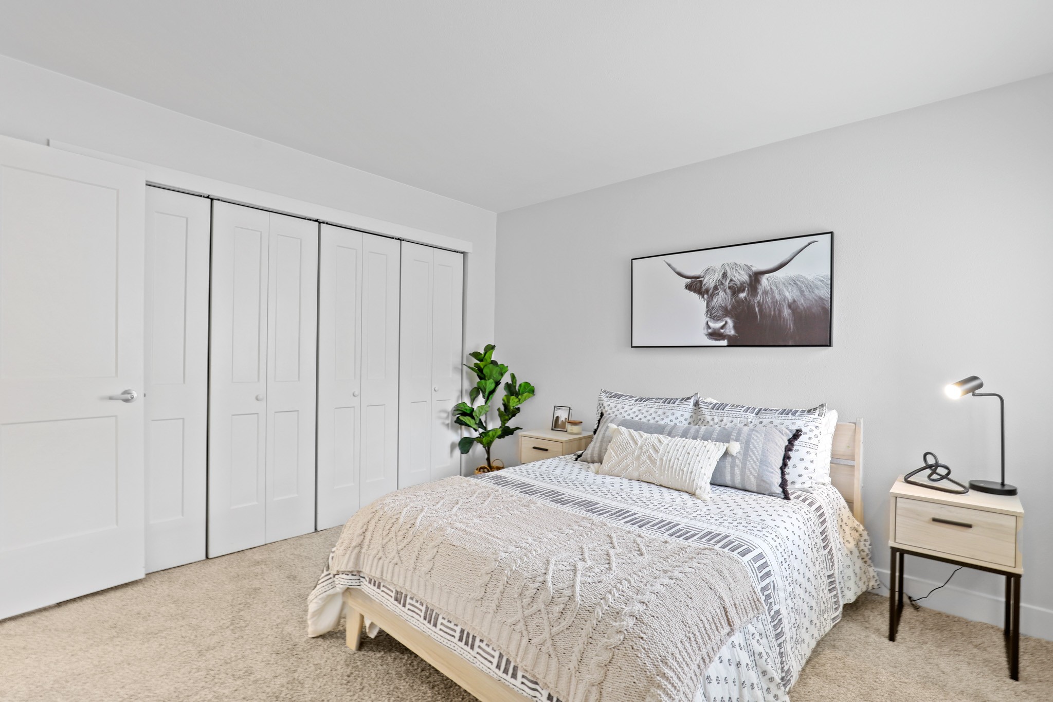Model bedroom with spacious closets at The Alpine