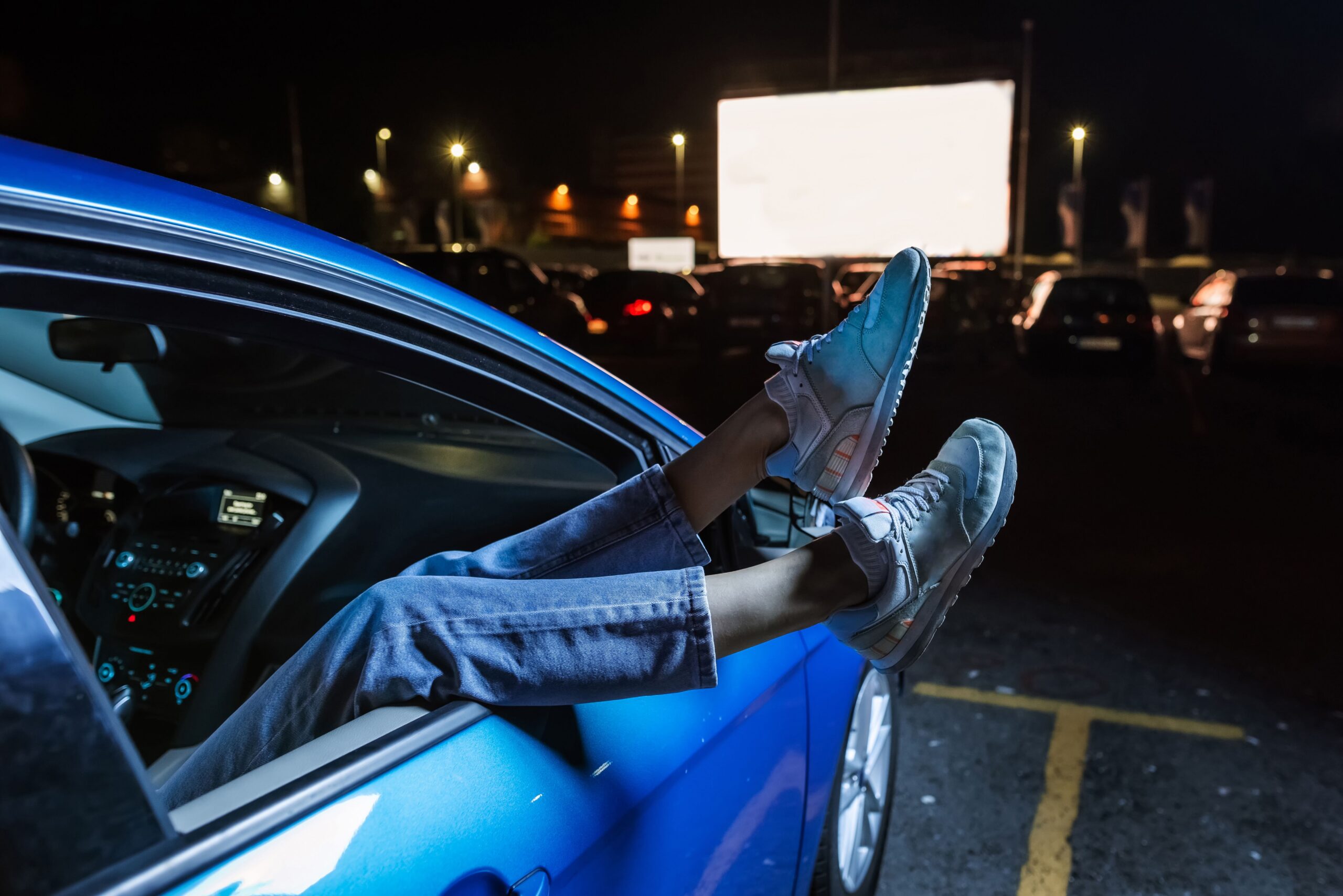 legs out car window drive in theater scaled